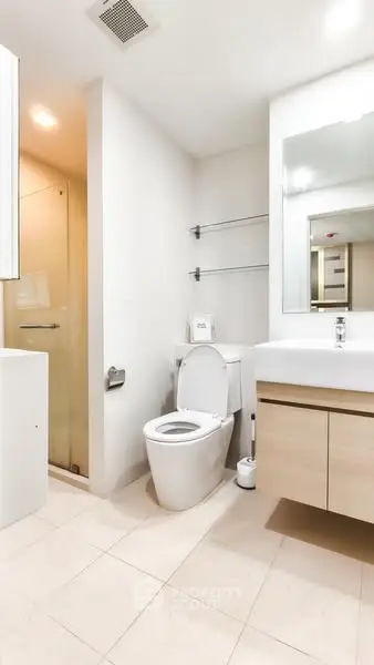 Modern bathroom with sleek fixtures and glass shower enclosure