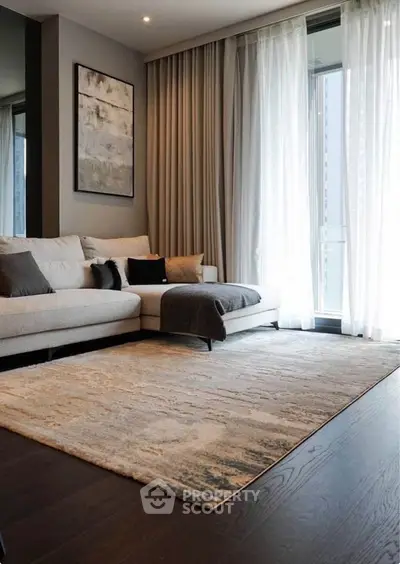 Elegant living room with modern decor and large windows for natural light.