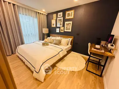 Cozy bedroom with stylish decor and workspace, perfect for modern living.