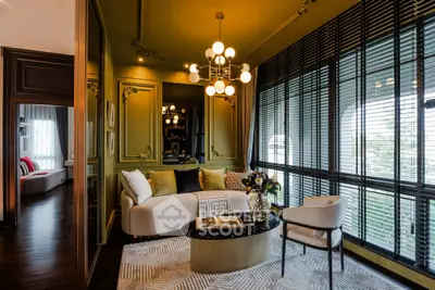 Luxurious living room with elegant decor and large windows offering natural light.