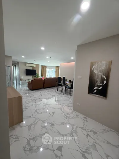 Spacious modern living room with marble flooring and elegant decor