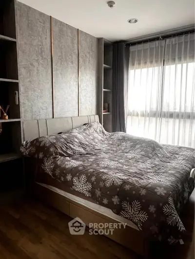 Cozy bedroom with modern decor and large window for natural light