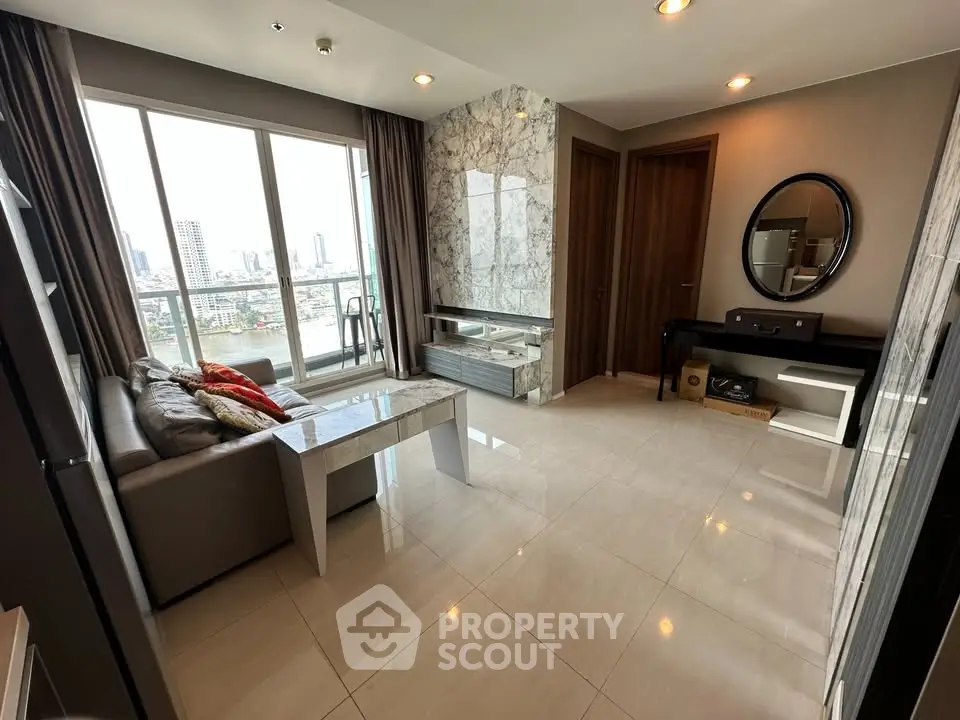 Luxurious living room with marble accents and city view balcony