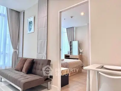 Modern apartment interior with stylish living room and cozy bedroom, featuring elegant decor and natural light.