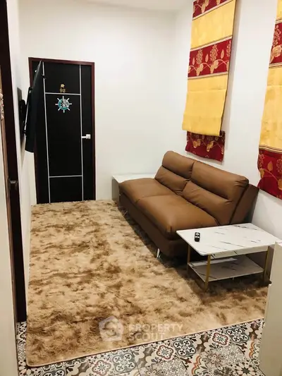 Cozy living room with plush carpet and modern sofa, perfect for relaxation.