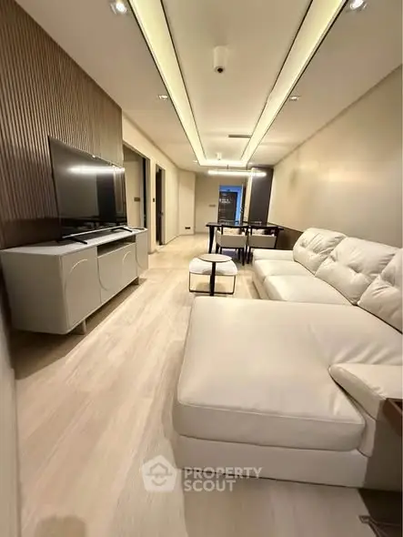 Modern living room with sleek furniture and ambient lighting