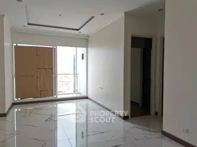 Spacious modern apartment with marble flooring and large windows for natural light.