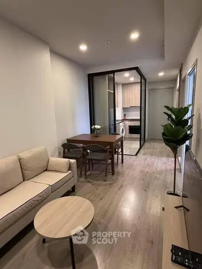 Modern living room with open kitchen and stylish furniture