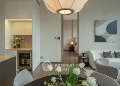 Modern open-plan living room with elegant decor and cozy ambiance