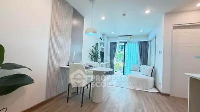 Modern living room with elegant decor and natural light, featuring a cozy dining area and stylish furniture.