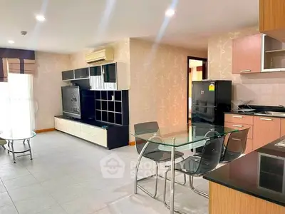 Spacious modern living room with open kitchen and stylish furniture in a bright apartment.