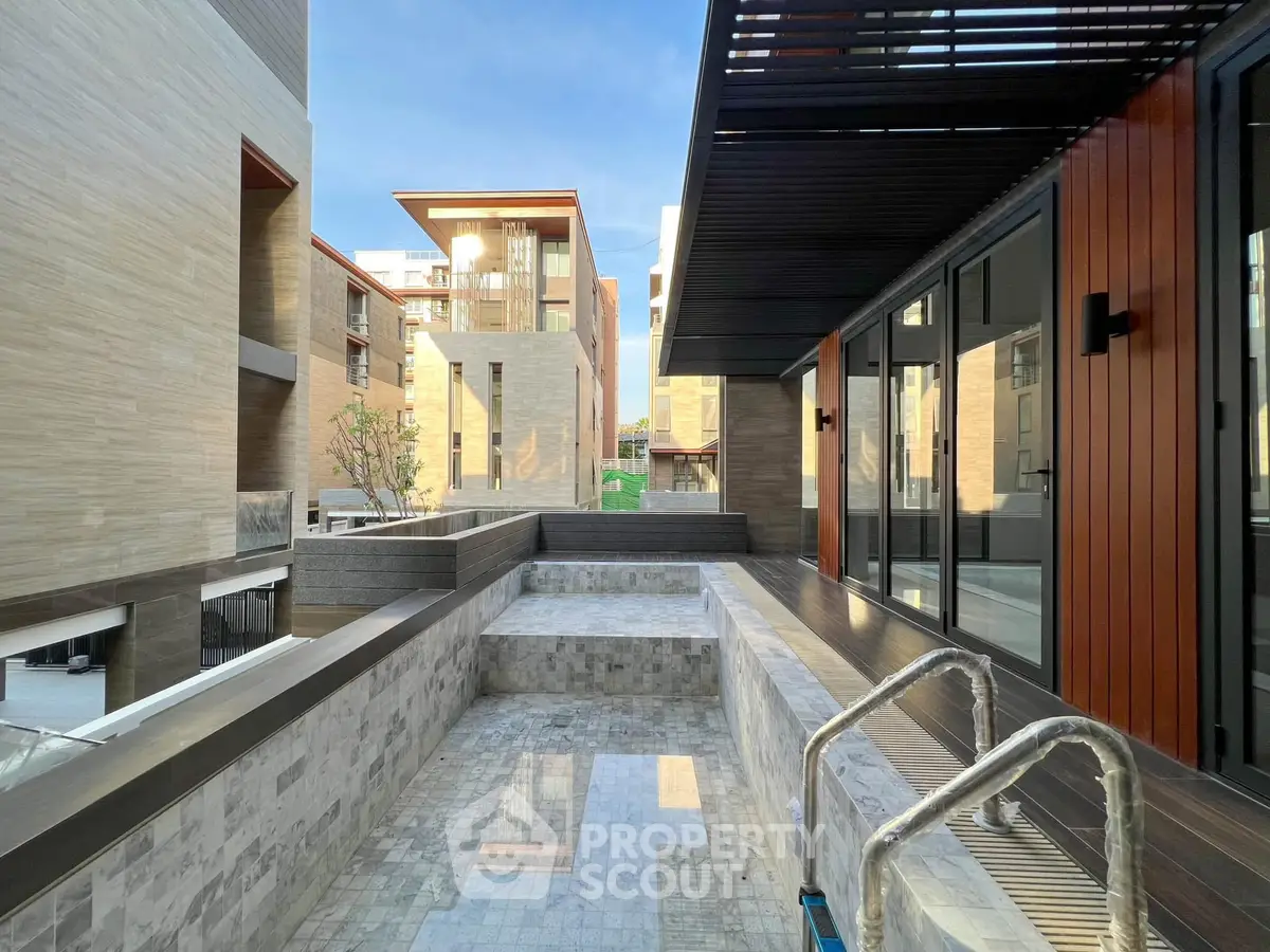 Modern architectural exterior with sleek design and spacious outdoor area