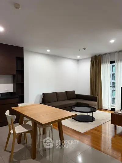 Modern living room with sleek furniture and open layout in a stylish apartment.