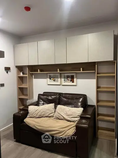 Cozy living room with modern sofa and stylish shelving unit