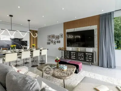 Luxurious open-plan living room with modern kitchen and stylish decor