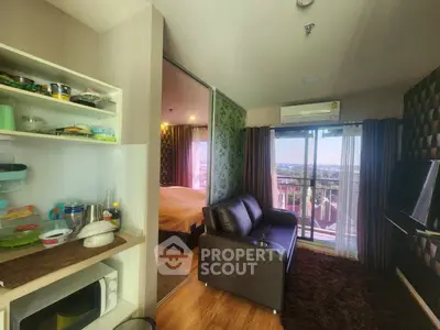 Modern condo interior with cozy living room, bedroom, and balcony view.