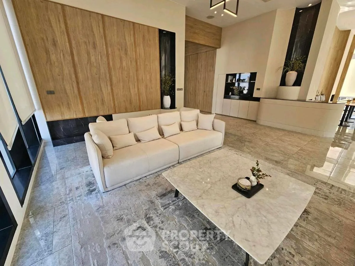 Luxurious modern living room with elegant marble flooring and stylish furniture
