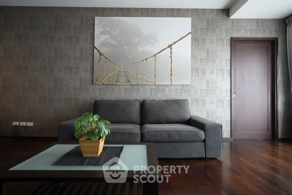 Modern living room with stylish decor and comfortable gray sofa