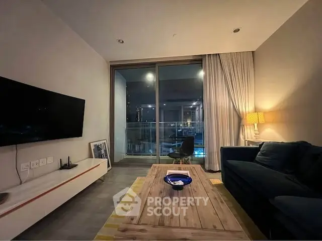 Modern living room with cozy sofa, stylish coffee table, and large window offering city view.