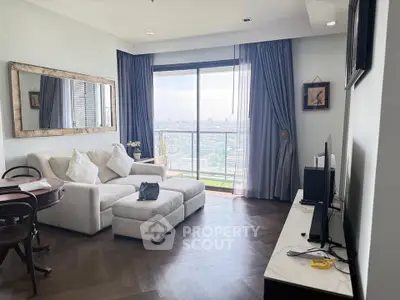 Elegant living room with city view, featuring cozy sofa and stylish decor, perfect for urban living.