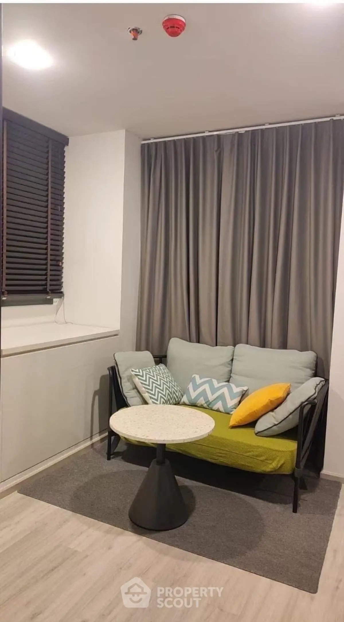 Cozy living room with modern sofa and stylish decor, perfect for relaxation.
