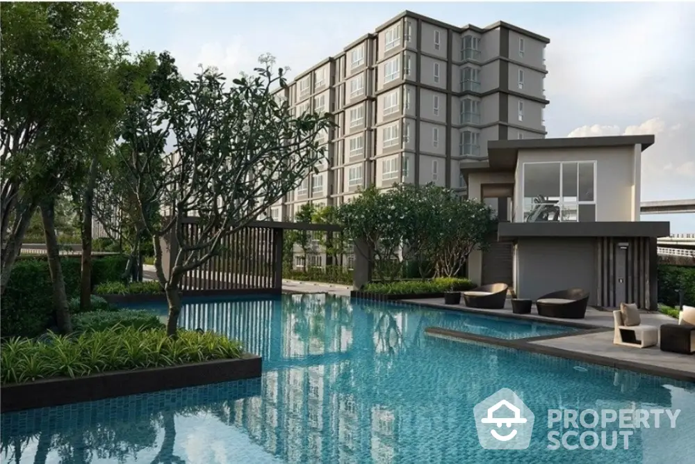 Luxurious modern apartment complex with serene pool and lush greenery.