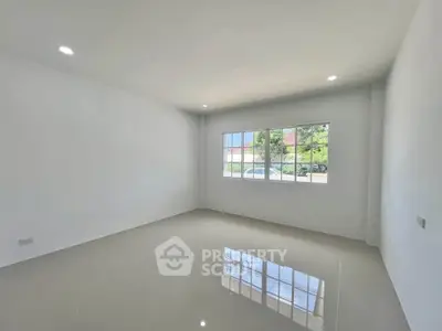 Spacious empty room with large window and glossy tiled floor, perfect for customization.