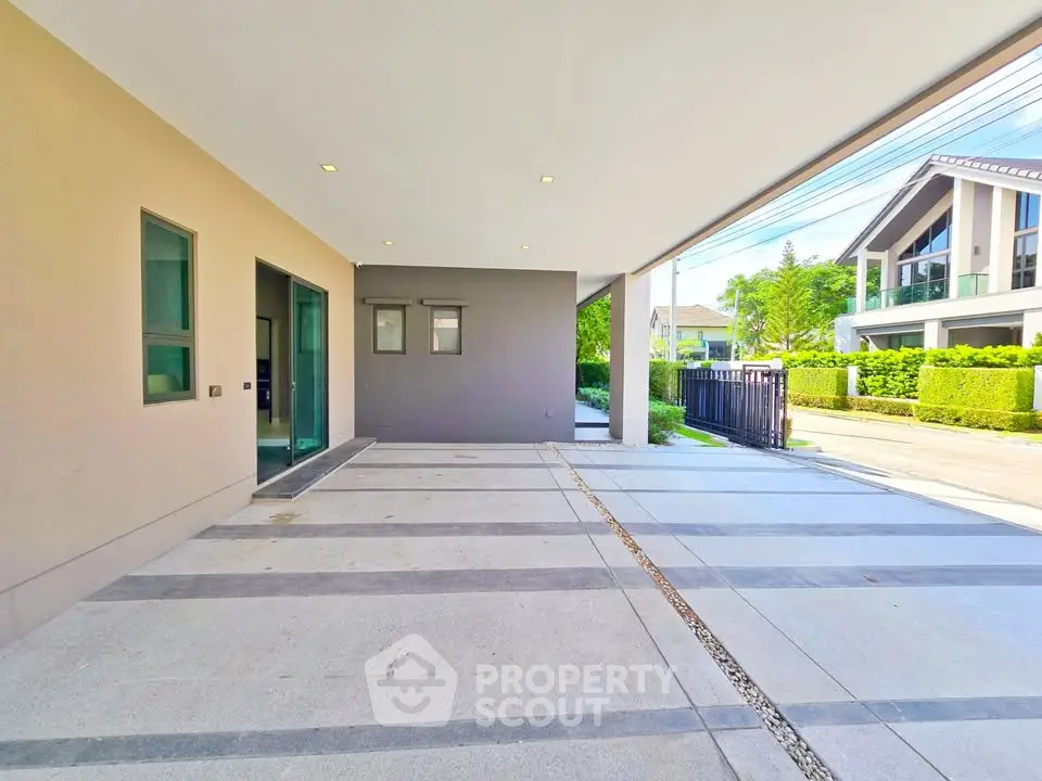 Modern house exterior with spacious driveway and contemporary design