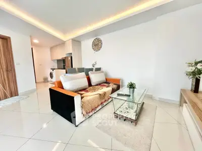 Modern living room with stylish decor and open kitchen layout