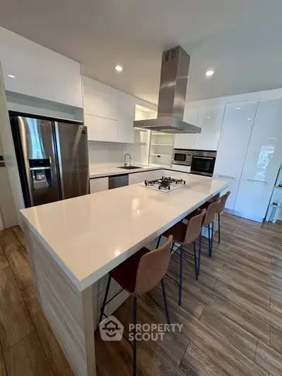 Modern kitchen with sleek island and stainless steel appliances