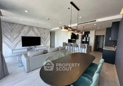 Modern open-plan living room with stylish decor and dining area