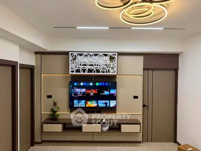 Modern living room with stylish TV unit and contemporary lighting