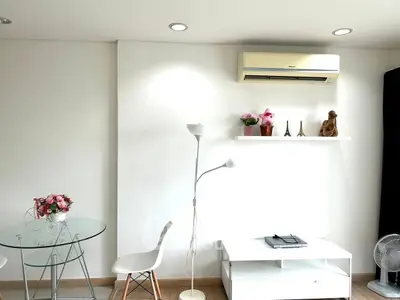 Modern living room with minimalist decor and air conditioning