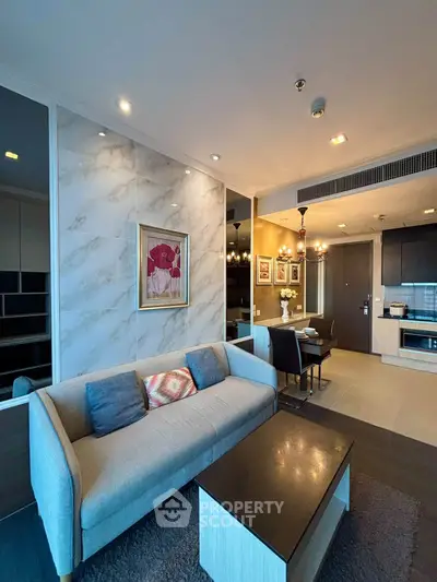 Modern living room with elegant decor and open kitchen layout