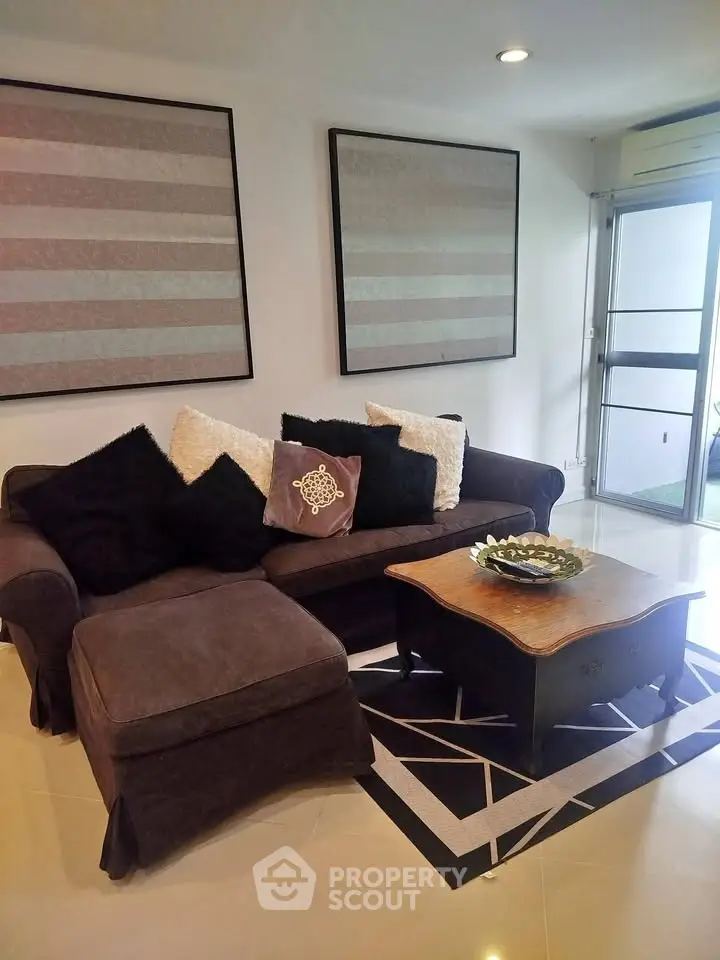 Stylish living room with cozy sofa and chic decor in modern apartment