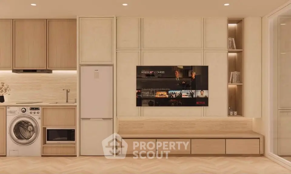 Modern living room with built-in entertainment center and kitchen appliances