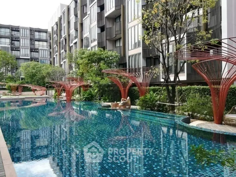 Luxurious condominium with stunning pool and modern architecture