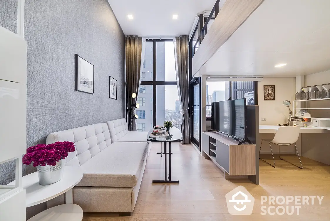 Elegant modern living room seamlessly connected to a chic open-layout kitchen, bathed in natural light from floor-to-ceiling windows, perfect for urban living.