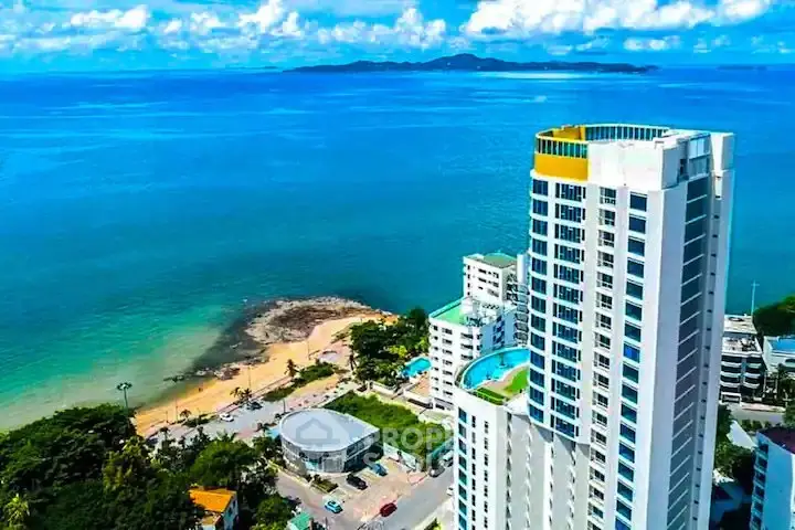Stunning beachfront high-rise with panoramic ocean views and luxurious amenities.