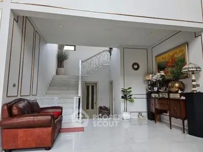 Elegant living room with leather sofa and stylish decor in a spacious home