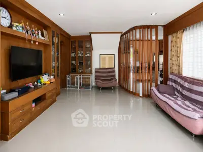 Spacious living room with modern decor and ample natural light