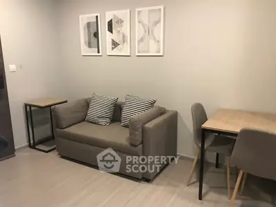 Cozy living room with modern decor and compact furniture setup