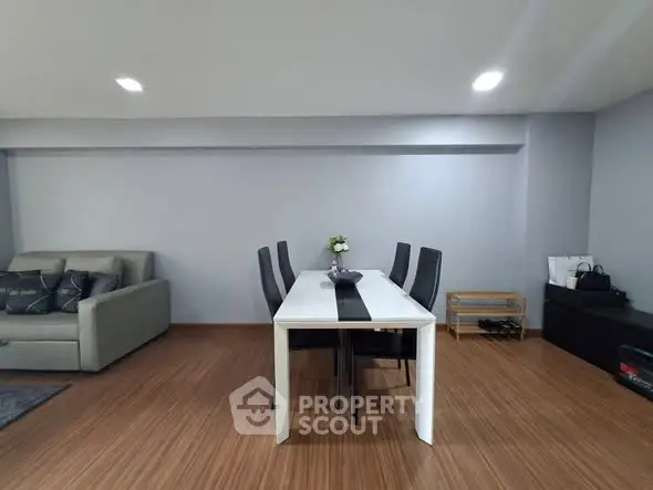 Spacious modern living room with sleek dining area and stylish decor