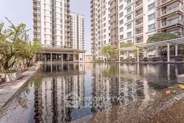 Luxurious condominium with stunning pool and modern architecture in prime location.