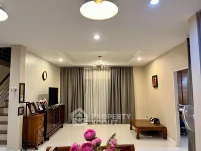 Spacious living room with elegant decor and natural lighting