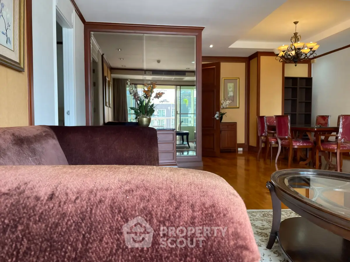 Luxurious living room with elegant dining area, plush seating, and sophisticated decor in a high-end apartment.