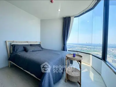 Luxurious bedroom with panoramic city view and modern decor