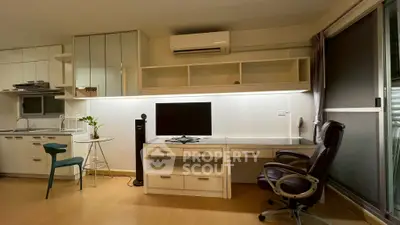 Modern home office with sleek desk, ergonomic chair, and stylish decor in a bright apartment.