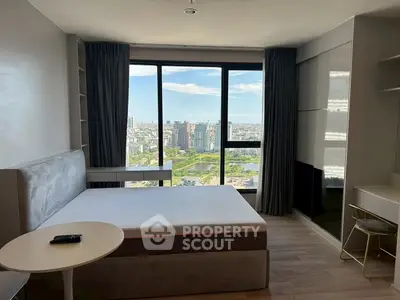 Modern bedroom with stunning city view and sleek furnishings