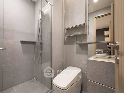 Modern bathroom with sleek design and glass shower enclosure